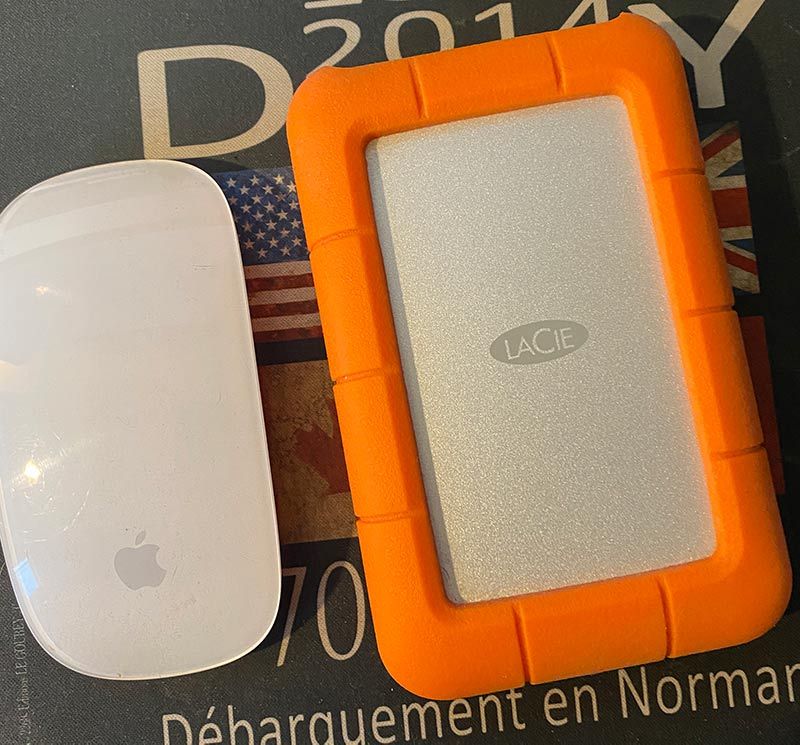Lacie Rugged 4tb External Hard disk next to mac mouse